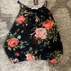 Black top with floral design